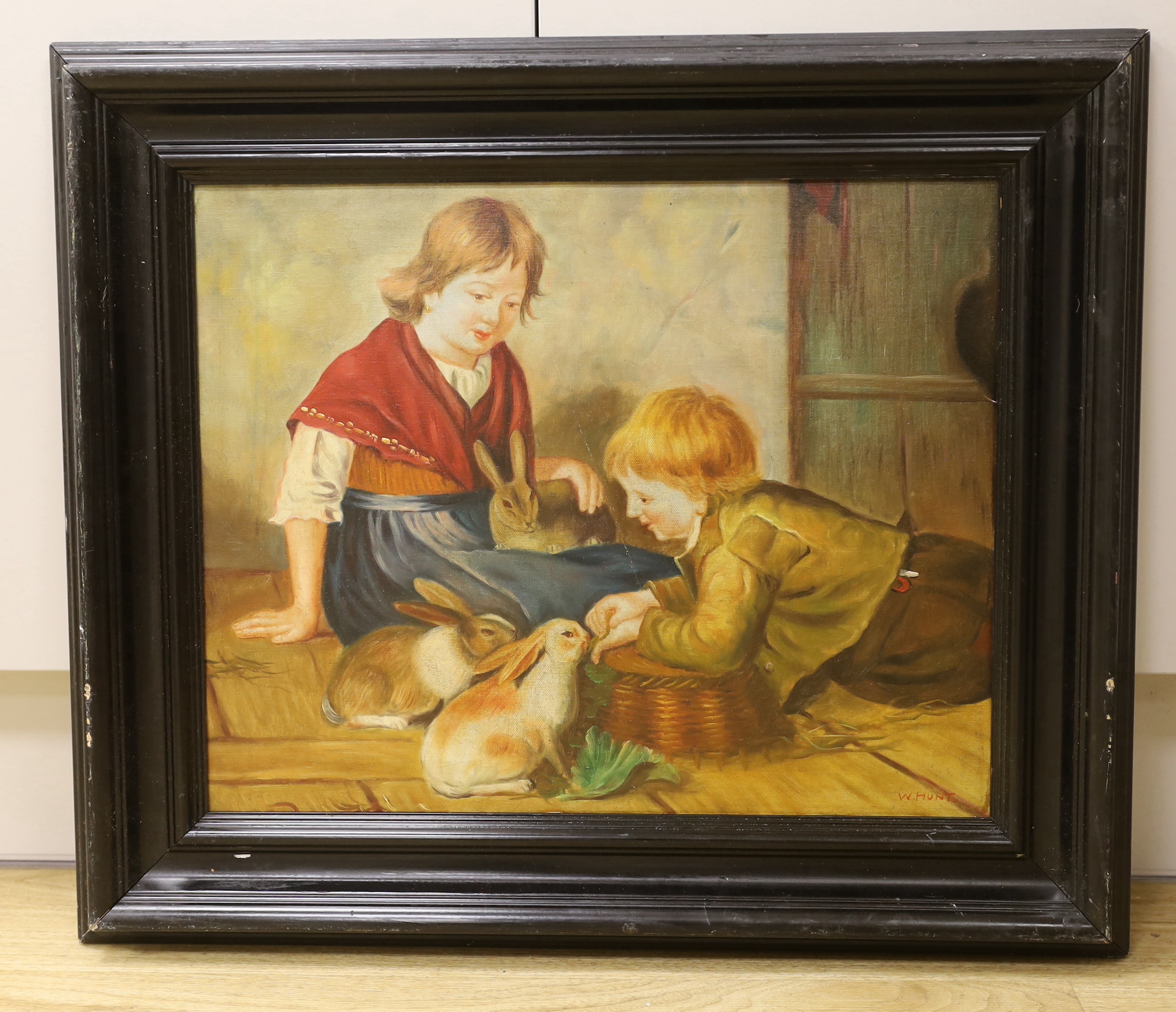 W.Hunt, oil on board, children with rabbits in an interior, 45 x 35cm